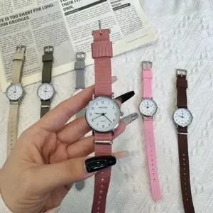 Minimalist quartz watch with durable canvas strap, stylish casual timepiece for students.