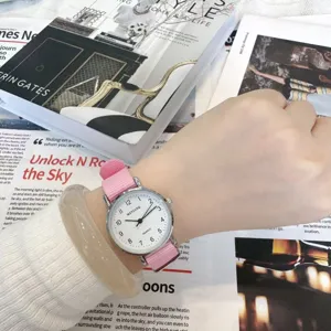 Casual minimalist women quartz watch with pink canvas strap and white dial for daily wear.