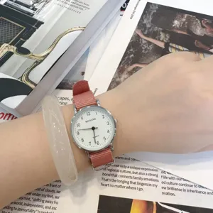 Minimalist student quartz watch with pink canvas strap and white dial for casual daily wear