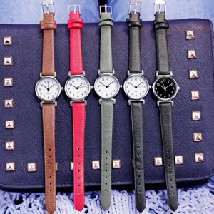 Simple retro quartz watch with slim leather strap, small dial, elegant women's timepiece.