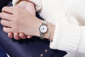 Minimalist women quartz watch with mesh strap and leaf bracelet, fashion student wristwatch.