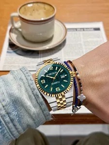 Detailed close up wrist view of luxury men quartz watch with green dial and steel band.