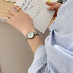 Minimalist women's quartz watch with metal strap and clean white dial for daily wear.