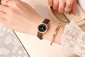 Elegant women's quartz watch with brown leather strap and small dial for daily style.
