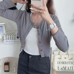 Korean style grey cardigan for women, simple casual long sleeve knit top with white inner.