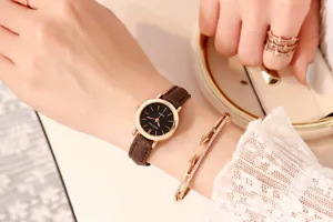 Women small dial quartz watch with brown leather strap and elegant crystal nail bracelet.