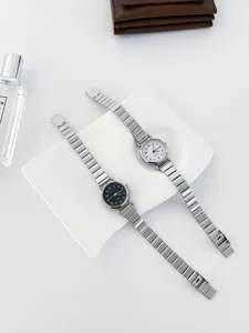 Minimalist women's quartz watch with slim metal strap, chic retro design for daily wear.