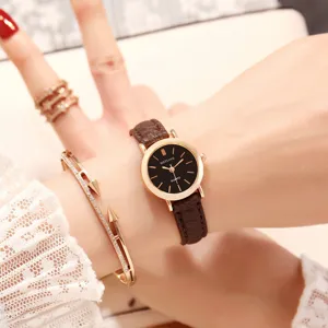Minimalist women quartz watch with brown leather strap and black dial for daily wear.