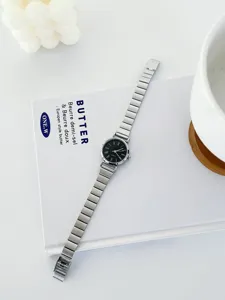 Elegant women quartz watch with black dial and silver metal strap for minimalist retro style.