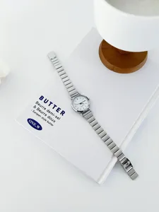 Minimalist women quartz watch with silver metal strap and clean white dial for daily wear.