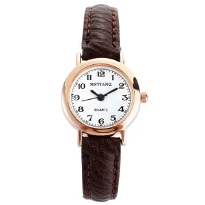 Women quartz watch with brown leather strap and rose gold round dial for daily wear.