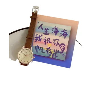 Minimalist women's quartz watch with brown leather strap and rose gold case for daily wear.