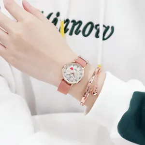 Detail view of a pink nylon strap quartz watch with heart dial and matching bracelet set.