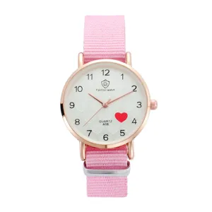 Pink nylon strap quartz watch with white dial, rose gold case, and cute heart pattern details.