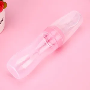 Silicone baby food squeeze bottle with spoon feeder for infant rice cereal and supplementary feeding.