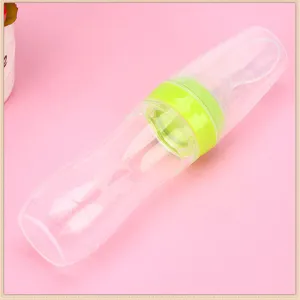 Baby silicone squeeze feeding bottle with spoon, safe infant food supplement feeder.