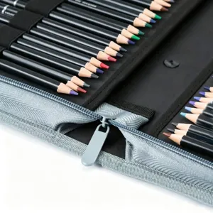 Detailed shot of colored pencils neatly arranged in a black and grey zipper case.