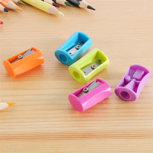 Colorful plastic manual pencil sharpeners for school and art, durable mini stationery items.