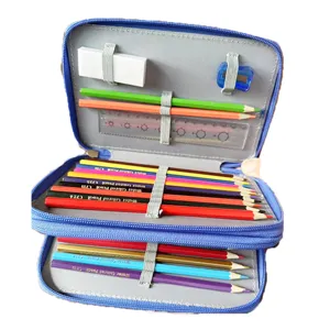 Trousse à crayons bleue multicouche avec crayons de couleur, gomme et règle pour les écoliers.