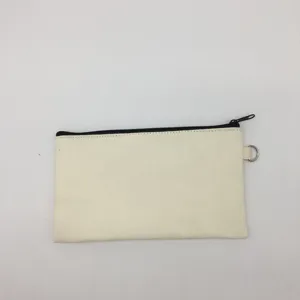 Detail view of plain canvas pencil pouch, black zipper, metal D-ring, ideal for DIY art.