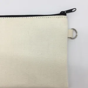 Plain canvas pencil pouch detail, blank beige cosmetic bag with black zipper and metal ring.