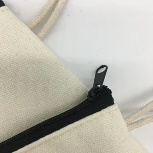 Canvas bag zipper detail white fabric pouch close up close-up shot minimalist design