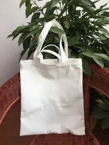 Blank canvas tote bag in detailed view, perfect for DIY printing and everyday shopping.