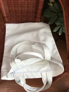 White canvas tote bag with zipper and dual handles, blank eco-friendly shopping bag for DIY.