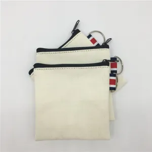 Canvas zipper coin purse with keychain and striped ribbon, simple white storage pouch.