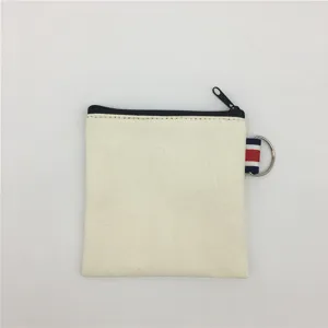 Canvas zipper coin pouch in off-white with black zipper and tricolor loop detail.
