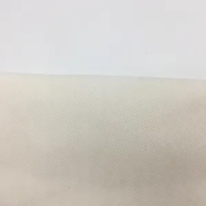 Close-up detail of smooth off-white fabric texture, clean canvas material for DIY craft.