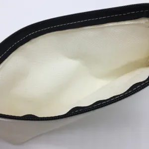 Close-up interior detail of white canvas zipper pencil case storage bag with black zipper.
