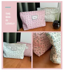 Floral canvas makeup bag detail, showing cute floral pattern, zipper closure and woven label.