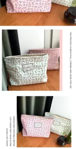 Floral canvas makeup pouch portable travel cosmetic storage bag with zipper closure design.