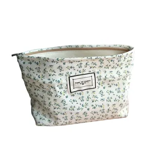Floral canvas cosmetic bag travel makeup pouch with zipper closure for daily organization.
