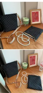Sac bandoulière noir à pois avec lanières interchangeables pour le quotidien et le bureau