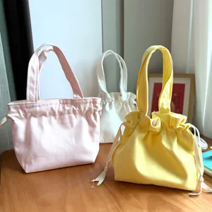 Cute canvas drawstring handbag, solid color Japanese style bento lunch bag for daily use.