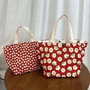 Cute canvas lunch tote bag with red floral print, stylish handbag for daily use and shopping.