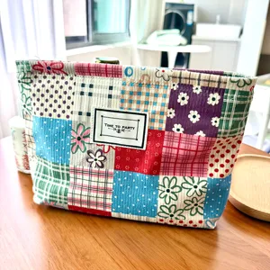 Large capacity portable patchwork cosmetic bag, creative plaid and floral travel makeup storage.