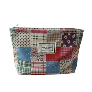 Large capacity patchwork cosmetic bag, retro corduroy makeup pouch with front label, main view.