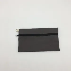 Einfache dunkelgraue Canvas-Reißverschlusstasche für Münzen, Schlüssel und Stifte.