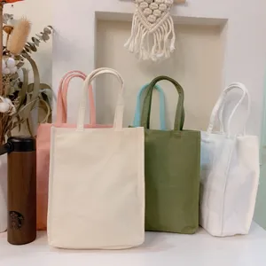 Detail view of solid color canvas tote bags in various shades, perfect for casual daily use.