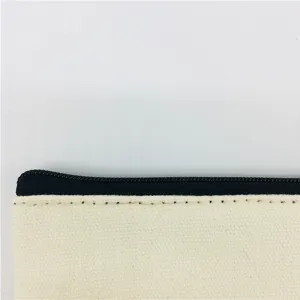 Close-up detail of canvas zipper pouch featuring neat black zipper and durable fabric stitching.