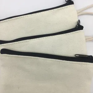 Close-up detail of blank canvas pencil cases stacked neatly, ideal for DIY painting and custom.