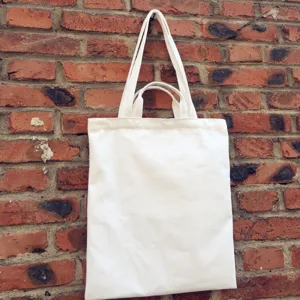 Plain white canvas tote bag with dual handles, perfect for daily shopping, DIY and eco use.
