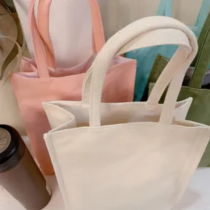 Detailed view of multi-color plain canvas tote bags, casual handbags, and reusable shopping bags.