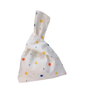 Japanese style fresh fabric wrist bag, cute colorful polka dot tote for daily casual use.