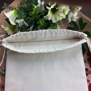 Plain white canvas drawstring bag, blank backpack for DIY painting and shopping use.
