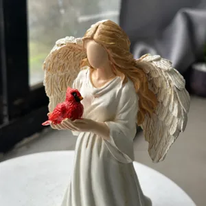 Resin angel figurine with red cardinal bird sculpture for home desktop decor and room ornament.