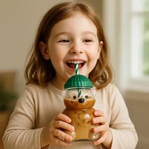 Cute bear glass straw cup with green lid, adorable cartoon teddy bear design for kids drinks.